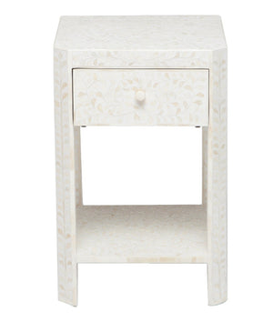 The Made Goods Lexi Nightstand is a compact, square white piece with one drawer, an open shelf below, and a subtle Indian leaf pattern design.