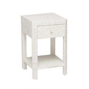 The Lexi Nightstand by Made Goods is a compact white piece with one drawer, a lower shelf, and a subtle Indian pattern for added elegance.