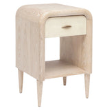 The Pierre Nightstand Collection by Made Goods features a light wood nightstand with a rounded frame, single drawer with a small handle, and an open lower shelf.