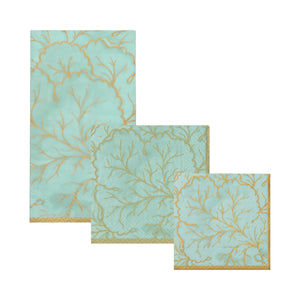 Three Caspari Gilded Majolica Saltwater Collection napkins, featuring an aqua and gold coral branch design, are displayed in large, medium, and small sizes—ideal for matching with your favorite elegant disposable plates.