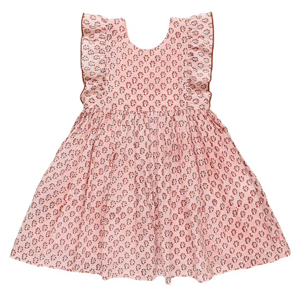 A Pink Chicken Girls' Marceline Dress with ruffled details.