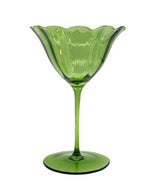 Part of the Duggan Society's Lily Collection, this elegant green glass goblet features a scalloped, flower-shaped rim and slender stem—ideal for anyone wanting unique and stylish tableware.