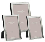 The Addison Ross Grooved Silver Plated Frame Collection features three upright frames in assorted sizes, each with a ribbed border and smooth back—an elegant choice for displaying photos in portrait or landscape orientation.