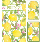 The Caspari Limoncello Bridge Collection features playing cards and a box adorned with watercolor lemons, green leaves, and pink flowers. "BRIDGE" is elegantly printed on the box—perfect for friendly games or your next bridge night.