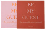 Two "Be My Guest Book" guest books by PrintWorks in rust and pink are shown—ideal for capturing memories and bringing stylish flair to your home.