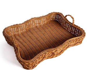 The Sharland England Hadley Tray Collection features a rectangular, brown hand-crafted wicker basket with curved sides, a single handle, and a subtle scalloped edge, displayed on a white background.
