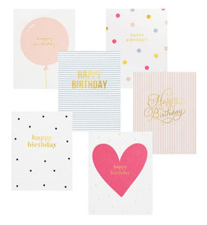 The Sugar Paper Birthday Card Set features six assorted cards, each with unique designs—balloons, hearts, stripes, polka dots—and gold foil "Happy Birthday" text.
