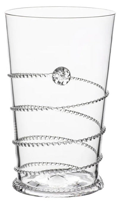 A clear tumbler from Juliska’s Amalia Drinkware Collection, featuring a textured spiral design and a raised circular accent.