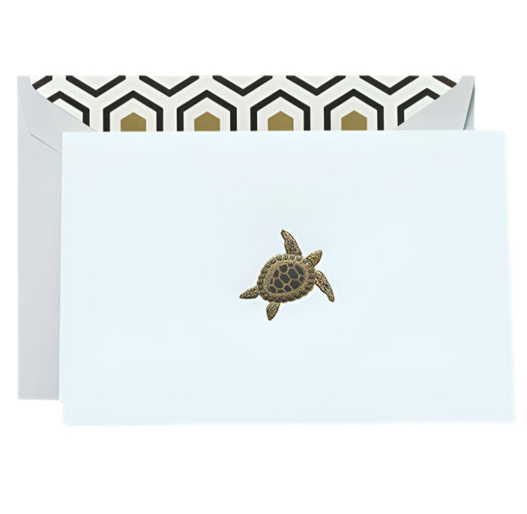 The Crane Turtle Classic Card Set includes a white notecard with a sea turtle illustration and an envelope lined with black and gold Art Deco geometric patterns, all printed on Beach Glass paper for a touch of coastal charm.