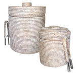 The image displays two woven cylindrical containers with lids from the Matahari White Washed Rattan Ice Bucket Collection. The larger one resembles an elegant ice bucket, complete with a handle and side-attached tongs.