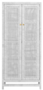 The Isla Cabinet in White Rattan by Made Goods showcases a tall design with natural peeled rattan in a basket weave pattern and is highlighted by double doors with elegant gold knobs.