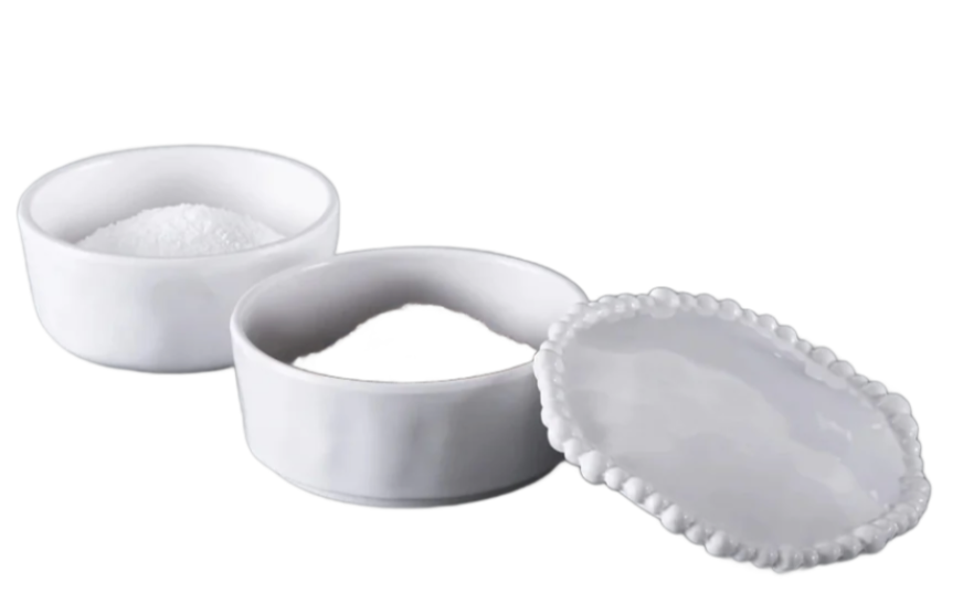 The Beatriz Ball Vida Alegria Melamine Stackable Salt and Pepper Cellar with Lid offers elegant, stackable white cellars—one open, one lidded—perfect for stylishly serving salt and pepper on a pristine white background.