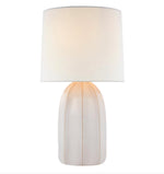 The Melanie Large Table Lamp Collection by Visual Comfort showcases a white, rounded base with reactive ceramic glazes and a cylindrical silk shade, beautifully photographed against a plain background.