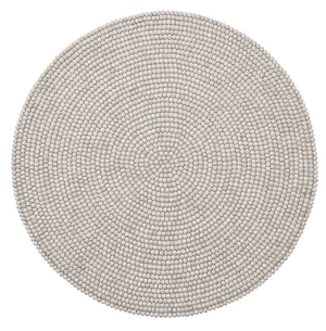 The Kim Seybert Driftwood Gray Placemat features handcrafted, small felt balls in concentric circles, offering a stylish round design that’s perfect for outdoor entertaining.