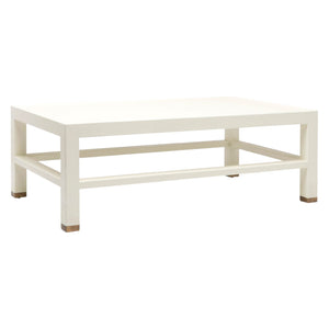 The Jarin Coffee Table by Made Goods features a rectangular white design with a lower support frame, wooden leg caps, and a textured faux Belgian linen finish for stylish appeal.