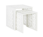 The Haret Outdoor Nesting Table by Hickory Chair features two white cast aluminum tables with geometric cut-out patterns, designed to nest together—ideal for any outdoor collection.