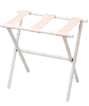 The Sorella Glenn White Luggage Rack, Fern Peachy Pink, features a white maple frame and three pink patterned fabric straps for stylish, functional suitcase storage.