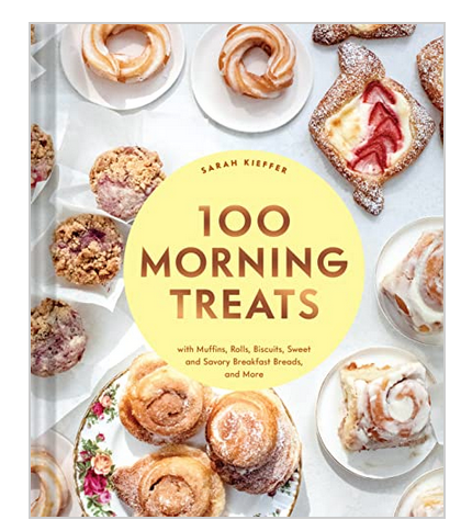 The cover of "100 Morning Treats" by Chronicle Books displays an assortment of pastries and baked goods, ideal for breakfast baking recipes, beautifully arranged on white plates.