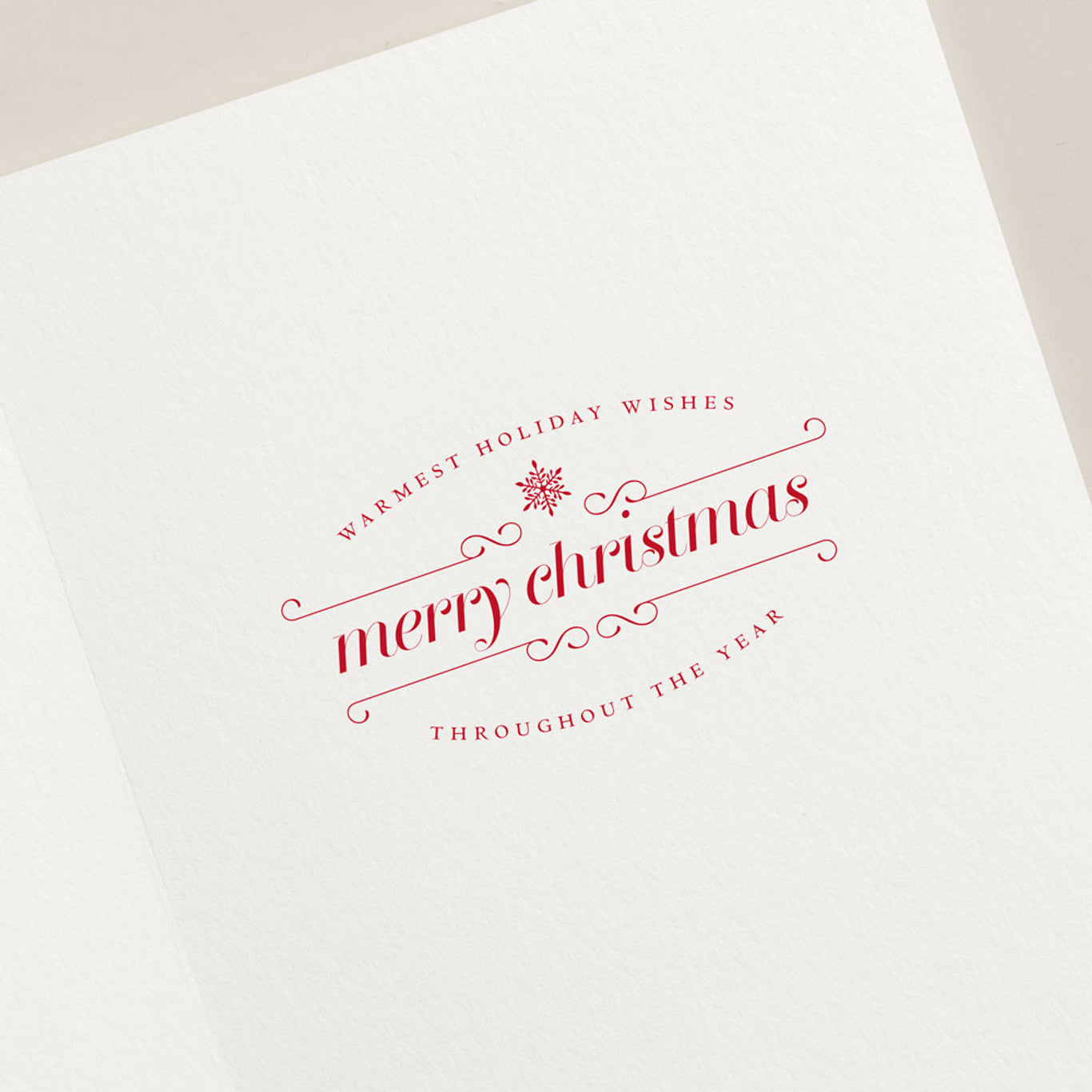 Send cheerful holiday wishes with the Festive Flamingo Card Set by Crane, featuring red text—"Warmest holiday wishes, merry Christmas, throughout the year"—and a central snowflake illustration. Perfect for festive greetings!.