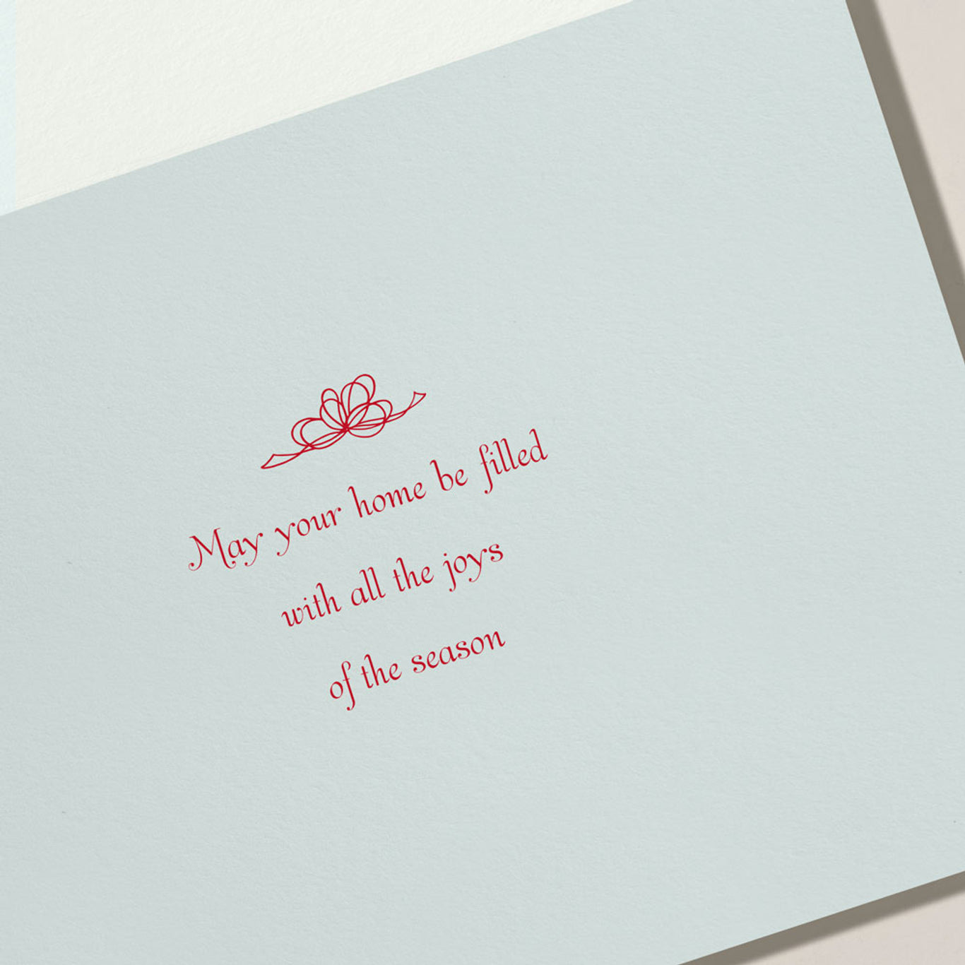 The Crane Elegant Christmas Seashells Card Set features a card with red script reading "May your home be filled with all the joys of the season" above a bow sketch—ideal for warm seaside holiday greetings.