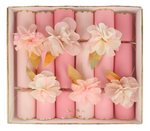 Add a festive touch to your party table or bridal shower with Meri Meri's Pink Tissue Floral Crackers—a box of eight pink crackers decorated with paper flowers and gold leaves, arranged in two neat rows.