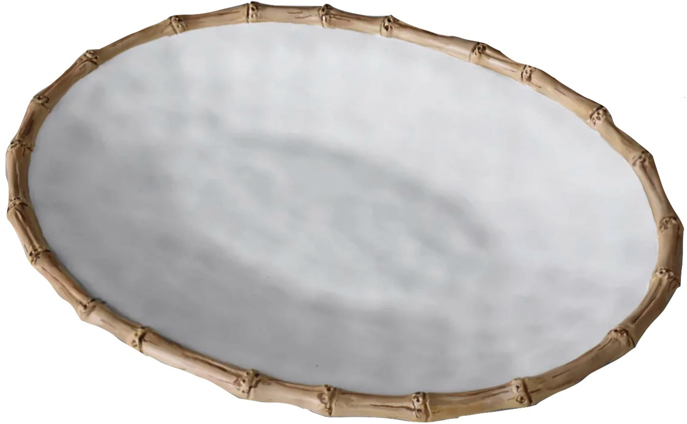 A round, white melamine plate with a textured surface and bamboo-inspired rim from Beatriz Ball’s Vida Natural Bamboo Serveware Collection—luxurious, break-resistant, and ideal for elegant dining.