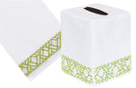 The Lido Bath Collection in green by Haute Home offers a white tissue box cover and matching towel, crafted from exquisite Italian linen with a green hand-embroidered geometric border design.