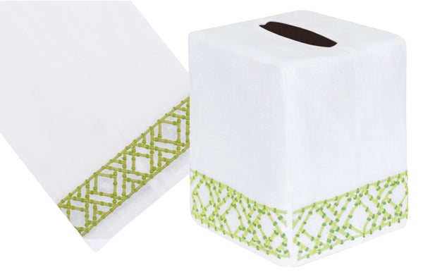 White Lido Collection tablecloth and tissue box cover with hand embroidered green lattice design trim on a white background by Haute Home.
