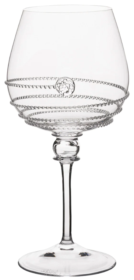 A clear wine glass from the Juliska Amalia Drinkware Collection, featuring a wide bowl, horizontal textured bands, and a small medallion pattern—an elegant piece inspired by classic Amalia glassware.
