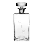 The Lillian Square Decanter Collection by William Yeoward Crystal features a handmade clear crystal decanter with "GIN" etched vertically and a stopper, making it an ideal gift. Displayed on a plain white background.