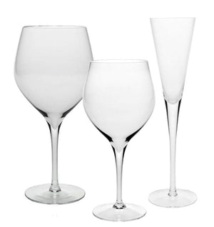 Three empty, clear glasses from the Lillian Drinkware Collection by William Yeoward Crystal, each with a fine rim and unique shape, are displayed side by side on a white background.