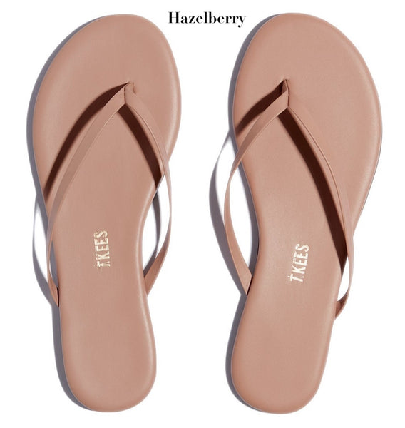 This pair of pink flip flops is part of the Tkees Lily Nudes Sandals collection.