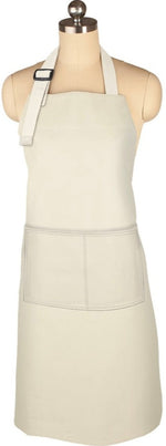 A durable, beige MUkitchen Classic Apron in linen with two front pockets and an adjustable fit is displayed on a dress form mannequin.
