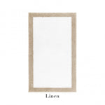The Egoist Border Bath Rug by Graciozza is a rectangular white rug with a customizable beige border, crafted from premium Egyptian cotton and labeled "Linen" underneath.