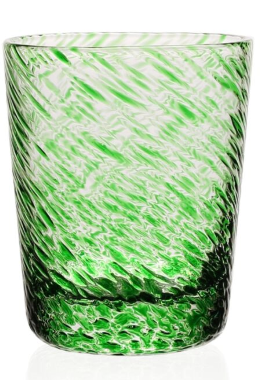 The Vanessa Green Drinkware Collection by William Yeoward Crystal features a clear optical illusion glass tumbler in Mediterranean forest green with white swirls, displayed on a white background.