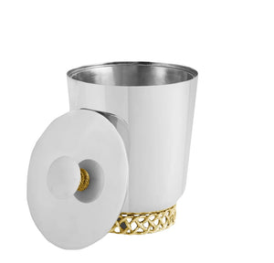 The Michael Aram Love Knot Ice Bucket features a silver finish, an open lid with a round handle, and a decorative gold base—symbolizing unity with its signature Love Knot accent atop the handle.