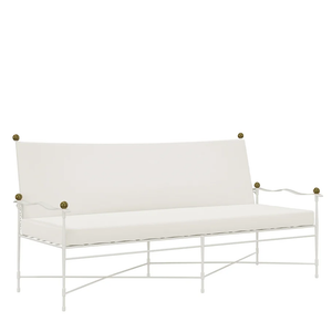 The Janus et Cie Amalfi Sofa in White Vermouth with Asti Cushion features a high backrest, flat seat cushion, curved armrests, and round brass finials—perfect for timeless luxury home decor.