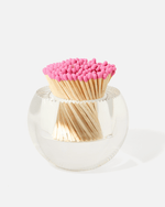 The Acrylic Match Striker Collection by Tart by Taylor adds charm to your coffee table, with pink-tipped matches artfully displayed in a clear vessel for a stylish accent.
