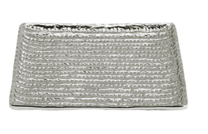 The Michael Aram Molten Matzah Plate is a rectangular, textured metallic plate with raised horizontal lines and a slightly elevated edge, inspired by Judaica ritual objects, displayed on a white background.