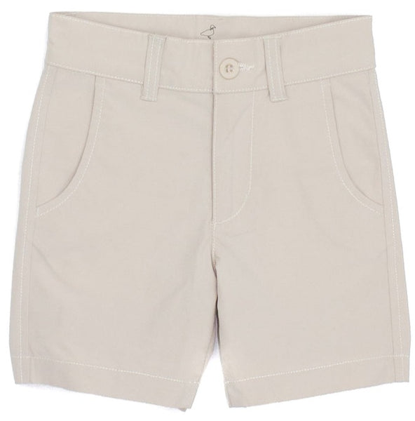A pair of Properly Tied Boys' Driver Shorts in beige with pockets and a button displayed on a plain background.