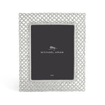 The Michael Aram Love Knot Silver Frame Collection features an 8x10 inch silver metal photo frame with a lattice design and includes a placeholder card.