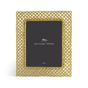 The Love Knot Gold Frame Collection by Michael Aram features a rectangular frame with an intricate gold lattice design, beautifully symbolizing unity, and includes a placeholder marked "Michael Aram" with the size 8x10.