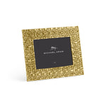 A square gold woven metal photo frame from the Palm Gold Frame Collection by Michael Aram, featuring sculpted textures and a central placeholder card displaying "Michael Aram" and a signature.
