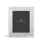 A rectangular nickel photo frame from the Reflective Frame Nickel Collection by Michael Aram features a wavy-edge border and includes a black card displaying "Michael Aram" and "8x10" in white text.