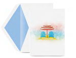 The Crane Perfect Day Ocean Note Card Set by Crane features two blue beach chairs and a red-striped umbrella on a sandy beach, paired with a matching blue and white envelope.