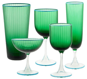 The Murano Striped Green Drinkware Collection by Aquazzura Casa features five handblown, uniquely shaped green glass pieces—including goblets, a coupe, and tall tumblers—beautifully displayed against a white backdrop.