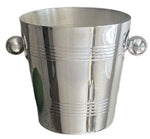 The Hôtel Silver Vintage Ice Bucket with Ball Handles features classic clean lines, rounded ball handles on each side, and horizontal engravings reminiscent of timeless hotel silver serve ware.