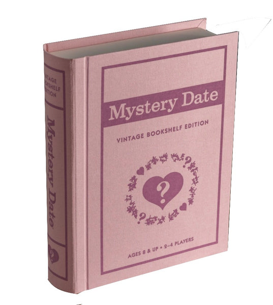 A board game styled to resemble a fabric-wrapped vintage pink book titled "WS Game Company Mystery Date Vintage Bookshelf Edition," indicating it's for ages 8 and up and 2-4 players.