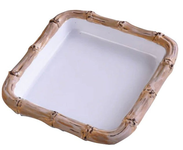 The Vida Bamboo Melamine Cocktail Napkin Holder by Beatriz Ball is a square white tray with raised edges and a light brown bamboo look, adding stylish luxury to any tabletop.