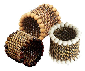 Set of three Calaisio Woven Napkin Rings, handmade by South Pacific artisans with water-vines and accented with beige, white, and brown beaded edges.